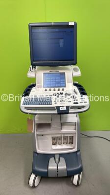 GE Logiq E9 Flat Screen Ultrasound Scanner Ref 5205000-7 *S/N 122479US9* **Mfd 11/2013** Software Version R4 Software Revision 3.1 (Powers Up - Some Damage to Casing and Keyboard Not Parking - See Photos)