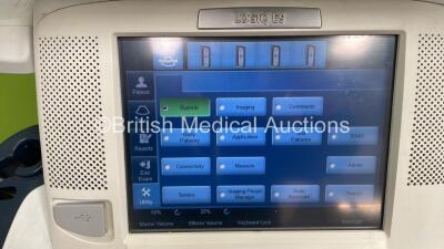 GE Logiq E9 Flat Screen Ultrasound Scanner Ref 5205000-7 *S/N 122479US9* **Mfd 11/2013** Software Version R4 Software Revision 3.1 (Powers Up - Some Damage to Casing and Keyboard Not Parking - See Photos) - 3