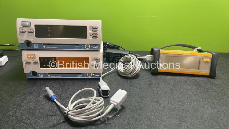 Mixed Lot Including 2 x Datex Ohmeda 3800 TruTrak+ Pulse Oximeters (Both Power Up) 1 x Datex Ohmeda Tru Sat Oximeter with 1 x AC Power Supply (No Power) *SN FBXG00262, FBXG00263, FCC07110166SA*