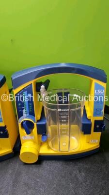 4 x LSU Laerdal Suction Units (All Power Up, 2 x with Damage to Casing) with 4 x Cups (3 x with Missing Lids) and 3 x Batteries *SN 78440965779 / 78231580046 / 78342091934 / 784514740528* - 2