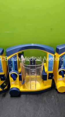 4 x LSU Laerdal Suction Units (All Power Up, 2 x with Damage to Casing) with 4 x Cups (3 x with Missing Lids) and 3 x Batteries *SN 78440965779 / 78231580046 / 78342091934 / 784514740528* - 3