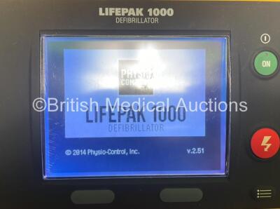 2 x Physio Control Lifepak 1000 Defibrillators with 4 x Batteries and 2 x Electrodes in 2 x Carry Cases (Both Power Up) - 4