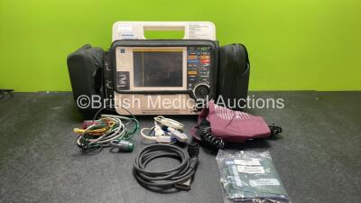 Medtronic Physio Control Lifepak 12 Biphasic Defibrillator / Monitor Including Pacer, ECG, SpO2 and Printer Options with 1 x 4 Lead ECG Lead, 1 x SpO2 Finger Sensor, 1 x Paddle Lead, 1 x NIBP Hose, 2 x BP Cuffs, 2 x Batteries In Carry Carry Bag (Powers Up