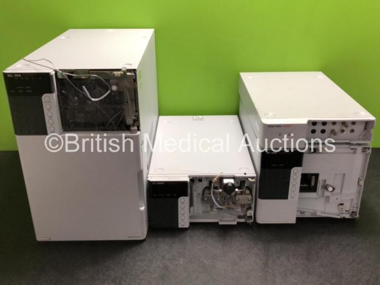 Job Lot Including 1 x Shimadzu SIL-20A Autosampler, 1 x Shimadzu LC-20AD Liquid Chromatograph, 1 x Shimadzu RF-20A Fluorescence Detector and 1 x Shimadzu DGU-20A3 Degasser (All Power Up with Missing Front Casing - See Photos)