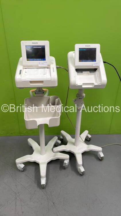 2 x Philips Avalon FM30 Fetal Monitors on Stands (Both Power Up - 1 x Missing Printer Cover - See Pictures)