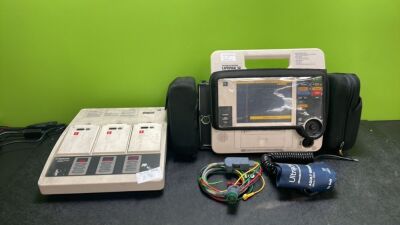 Job Lot Including 1 x Medtronic Physio Control Lifepak 12 Biphasic Defibrillator / Monitor Including ECG and Printer Options with 1 x Physio Control Battery Support System 2 Charger and 5 x Batteries, 1 x 4 Lead ECG Lead, 1 x NIBP Hose and 1 x BP Cuff (Bo