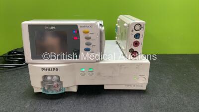 Job Lot Including 1 x Philips M1019A IntelliVue G5 Gas Module (Powers Up) 1 x Philips IntelliVue X2 Handheld Patient Monitor Including ECG, Press, Temp,SpO2 and NIBP Options with 1 x Battery (Powers Up with Missing Side Cover-See Photo) 1 x Philips M3001A