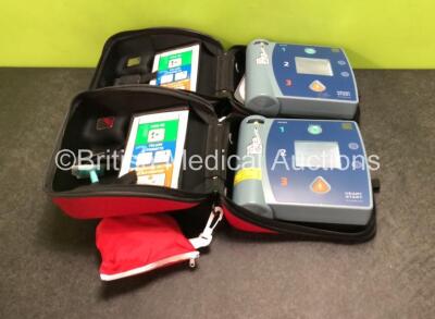 2 x Philips Heartstart FR2+ Defibrillators with 2 x Batteries in Carry Cases (Both Power Up) *SN 0511890380 / 0511890546*