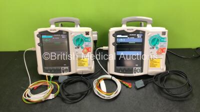 2 x Philips Heartstart MRx Defibrillators Including ECG and Printer Options with 2 x ECG Leads, 2 x Paddle Leads, 2 x Philips M3538A Batteries and 2 x Philips M3539A Modules (Both Power Up) *SN US00330800 / US00570190*