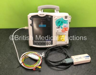 Philips Heartstart MRx Defibrillator Including ECG and Printer Options with 1 x ECG Lead, 1 x Paddle Lead, 1 x Test Load, 1 x Philips M3538A Battery and 1 x Philips M3539A Module (Powers Up with Slight Damage to Screen - See Photos) *SN US00330801*