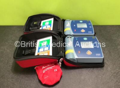 2 x Philips Heartstart FR2+ Defibrillators with 2 x Batteries in Carry Cases (Both Power Up) *SN 0511890731 / 0511890362*