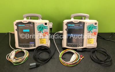 2 x Philips Heartstart MRx Defibrillators Including ECG and Printer Options with 2 x ECG Leads, 2 x Paddle Leads, 2 x Philips M3538A Batteries and 2 x Philips M3539A Modules (Both Power Up) *SN US00324364 / US00326353*