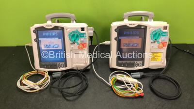 2 x Philips Heartstart MRx Defibrillators Including ECG and Printer Options with 2 x ECG Leads, 2 x Paddle Leads, 2 x Philips M3538A Batteries and 2 x Philips M3539A Modules (Both Power Up) *SN US00330803 / US00324361*