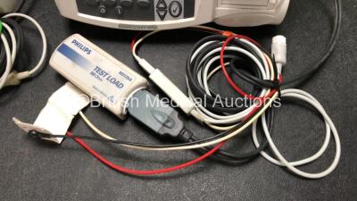 2 x Philips Heartstart MRx Defibrillators Including ECG and Printer Options with 2 x M3725A Test Loads, 2 x Paddle Leads, 2 x ECG Leads, 2 x Batteries and 1 x M33539A Module (Both Power Up then Shut Down - See Photos) - 6