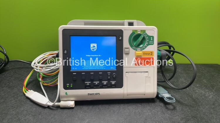 Philips Heartstart XL+ Defibrillator Including ECG and Printer Options with 1 x Paddle Lead, 1 x 3 Lead ECG Lead and 1 x Battery (Powers Up) *SN US31410959*