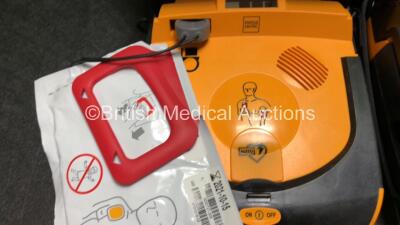 2 x Physio Control Lifepak CR Plus Defibrillators with 1 x Electrode Pads *Both Expired* in 2 x Carry Cases (Both Power Up) - 2