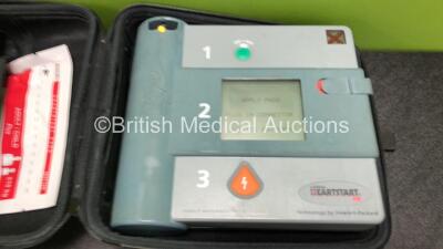 Job Lot Including 1 x Laerdal Heartstart FR Defibrillator and 1 x Heartstream FR Defibrillator with 1 x Battery, 1 x Electrode Pack *Expired* and 1 x Carry Case (Both Power Up) - 2