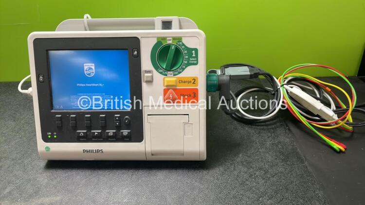 Philips Heartstart XL+ Defibrillator Including ECG and Printer Options with 1 x Paddle Lead, 1 x 3 Lead ECG Lead and 1 x Battery (Powers Up) *SN US31410965*