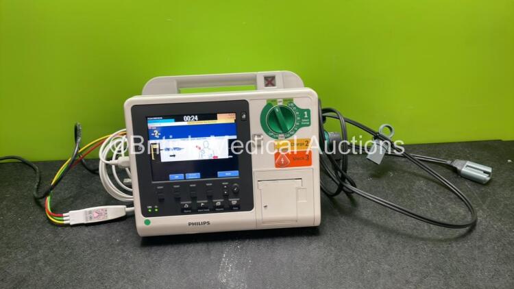 Philips Heartstart XL+ Defibrillator Including ECG and Printer Options with 1 x Paddle Lead, 1 x 3 Lead ECG Lead and 1 x Battery (Powers Up) *SN US71514633*