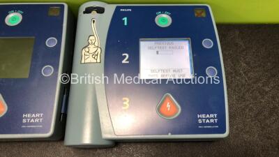 3 x Philips Heartstart FR2+ Defibrillators with 3 x Philips M3863A Batteries (2 x Power Up and Fail Self Test, 1 x No Power) - 2