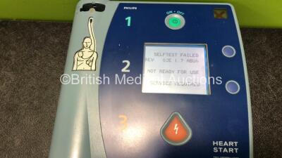 3 x Philips Heartstart FR2+ Defibrillators with 3 x Philips M3863A Batteries (2 x Power Up and Fail Self Test, 1 x No Power) - 4