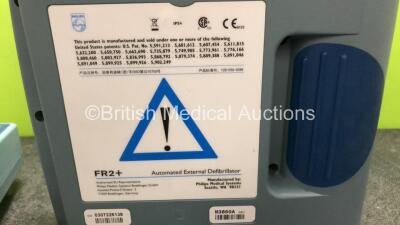 3 x Philips Heartstart FR2+ Defibrillators with 3 x Philips M3863A Batteries (2 x Power Up and Fail Self Test, 1 x No Power) - 5