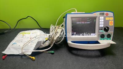 Zoll R Series Plus Defibrillator / Monitor Including Pacer, ECG and Printer Options with 1 x Zoll Sure Power II Battery, 1 x 3 Lead ECG Lead and 1 x Zoll Onestep Adult Electrode Pads *Exp 28-04-2024* (Powers Up)