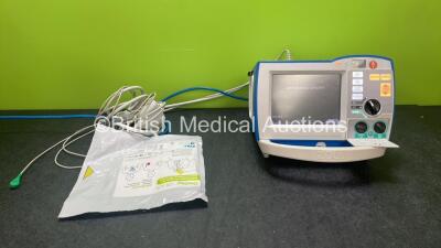 Zoll R Series Plus Defibrillator / Monitor Including Pacer, ECG and Printer Options with 1 x Zoll Sure Power II Battery, 1 x 3 Lead ECG Lead and 1 x Zoll Onestep Adult Electrode Pads *Exp 28-04-2024* (Powers Up)