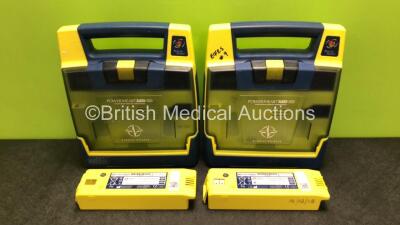 2 x Cardiac Science Powerheart AED G3 Automated External Defibrillators with 4 x Batteries (Both Power Up, 1 x Requires Service)