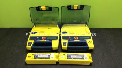 2 x Cardiac Science Powerheart AED G3 Automated External Defibrillators with 4 x Batteries (Both Power Up, 1 x Requires Service) - 2