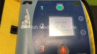 2 x Laerdal Heartstart FR2+ Defibrillators with 2 x Batteries *Install Dates 2021 / 2022* and 2 x Electrode Packs *Both Expired* in Carry Cases (Both Power Up) - 2