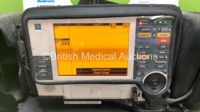 Medtronic Lifepak 12 Biphasic Defibrillator / Monitor Including Pacer, ECG, CO2, SpO2 and NIBP Options with BP Cuff, Hose and ECG Lead in Carry Case (Powers Up with Damage to Casing and Low Battery - See Photos) - 2