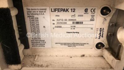 Medtronic Lifepak 12 Biphasic Defibrillator / Monitor Including Pacer, ECG, CO2, SpO2 and NIBP Options with BP Cuff, Hose and ECG Lead in Carry Case (Powers Up with Damage to Casing and Low Battery - See Photos) - 9