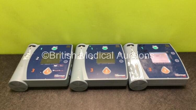 3 x Philips Heartstart FR2+ Defibrillators with 3 x Philips M3863A Batteries (1 x Powers Up and Passes Self Test, 2 x No Power)