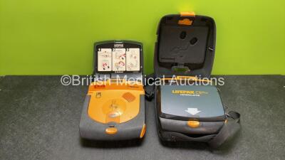 2 x Physio Control Lifepak CR Plus Defibrillators with 1 x Electrode Pads in 1 x Carry Case (Both No Power Due to Possible Flat Batteries)