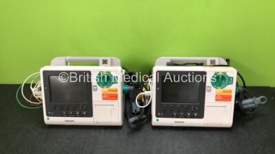 2 x Philips Heartstart XL+ Defibrillators Including ECG and Printer Options with 2 x ECG Leads, 2 x Paddle Leads and 2 x Batteries (Both Power Up) *SN US31410950 / US31410974*