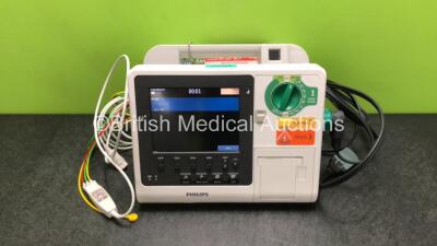 Philips Heartstart XL+ Defibrillator Including ECG and Printer Options with 1 x ECG Lead, 1 x Paddle Lead and 1 x Battery (Powers Up) *SN USD1615717*