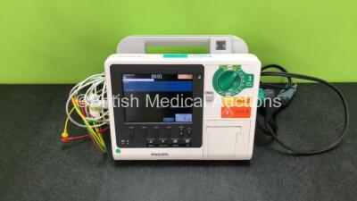 Philips Heartstart XL+ Defibrillator Including ECG and Printer Options with 1 x ECG Lead, 1 x Paddle Lead and 1 x Battery (Powers Up) *SN US31410916*