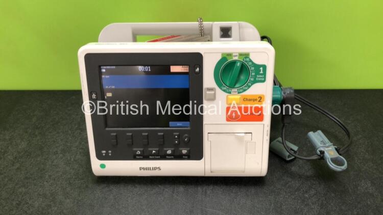 Philips Heartstart XL+ Defibrillator Including ECG and Printer Options with 1 x Paddle Lead and 1 x Battery (Powers Up) *SN US31410981*