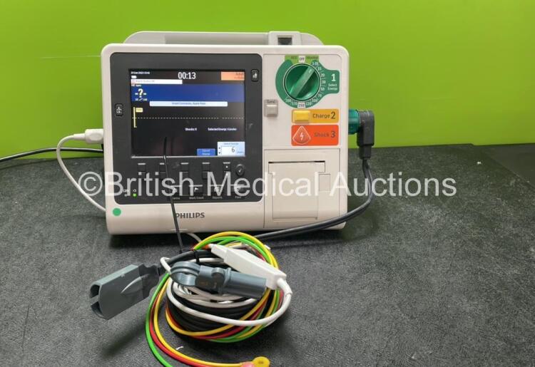 Philips Heartstart XL+ Defibrillator Including ECG and Printer Options with 1 x Paddle Lead, 1 x 3 Lead ECG Lead and 1 x Battery (Powers Up) *SN US31410939*