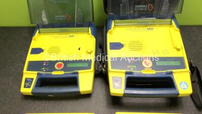 2 x Cardiac Science Powerheart AED G3 Automated External Defibrillators with 4 x Batteries and 1 x Carry Case (Both Power Up) - 2