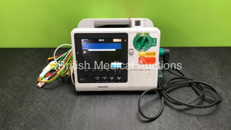 Philips Heartstart XL+ Defibrillator Including ECG and Printer Options with 1 x ECG Lead, 1 x Paddle Lead and 1 x Battery (Powers Up) *SN USD1615723*