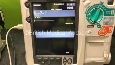 2 x Philips Heartstart MRx Defibrillators Including ECG and Printer Options with 2 x M3725A Test Loads, 2 x Paddle Leads, 1 x ECG Lead, 1 x Battery and 1 x M33539A Module (Both Power Up, 1 x Slight Damage to Casing - See Photos) - 3