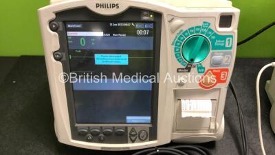 2 x Philips Heartstart MRx Defibrillators Including ECG and Printer Options with 2 x M3725A Test Loads, 2 x Paddle Leads, 1 x ECG Lead, 1 x Battery and 1 x M33539A Module (Both Power Up, 1 x Slight Damage to Casing - See Photos) - 6