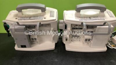 2 x Philips Heartstart MRx Defibrillators Including ECG and Printer Options with 2 x M3725A Test Loads, 2 x Paddle Leads, 1 x ECG Lead, 1 x Battery and 1 x M33539A Module (Both Power Up, 1 x Slight Damage to Casing - See Photos) - 8