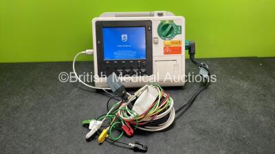 Philips Heartstart XL+ Defibrillator Including ECG and Printer Options with 1 x Paddle Lead, 1 x 5 Lead ECG Lead and 1 x Battery (Powers Up) *SN US31410976*