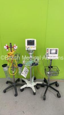 Mixed Lot Including Fukuda Denshi Dynascope DS-5100E Patient Monitor on Stand, 1 x Fukuda Denshi Dynascope DS-7100 Patient Monitor on Stand and 1 x Regulator on Stand (Both Power Up) *S/N 09070065 / 500000449* - 2