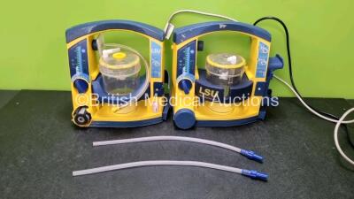 2 x LSU Laerdal Suction Units (Both Power Up, Both with Damage to Casing - See Photos) with 2 x Suction Cups and Hoses