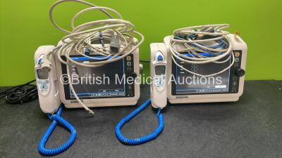 2 x Philips Sure Signs VS4 Patient Monitors Including 2 x Covidien Genius 2 Thermometers and 2 x SpO2 Leads (Both Power Up, 1 with Damaged Antenna-See Photo) *SN US42719305. US42719302*