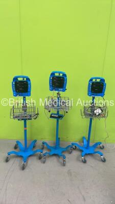 3 x GE Dinamap ProCare Vital Signs Monitors on Stands (Al Power Up - 1 x Error Displayed - 1 x Loose Front Panel)